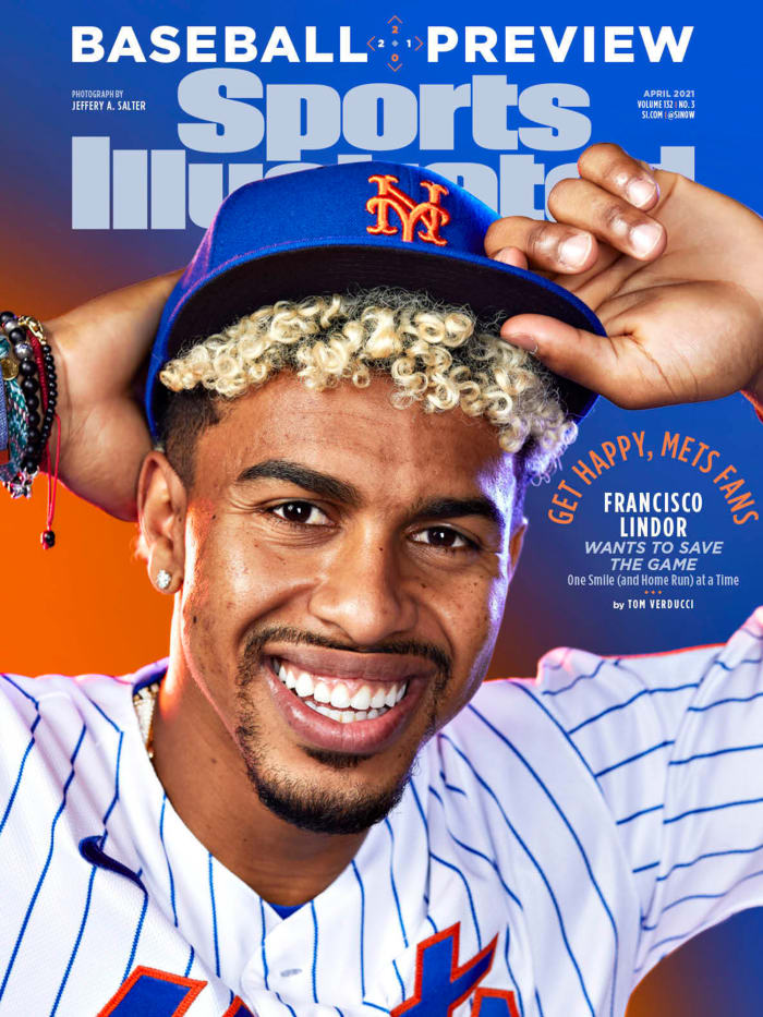 Francisco Lindor poses with his new Mets hat